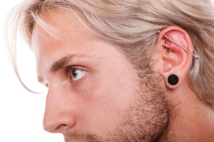 man with  multiple piercings Kimble Beauty Piercing Aftercare