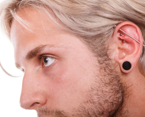 man with multiple piercings Kimble Beauty Piercing Aftercare